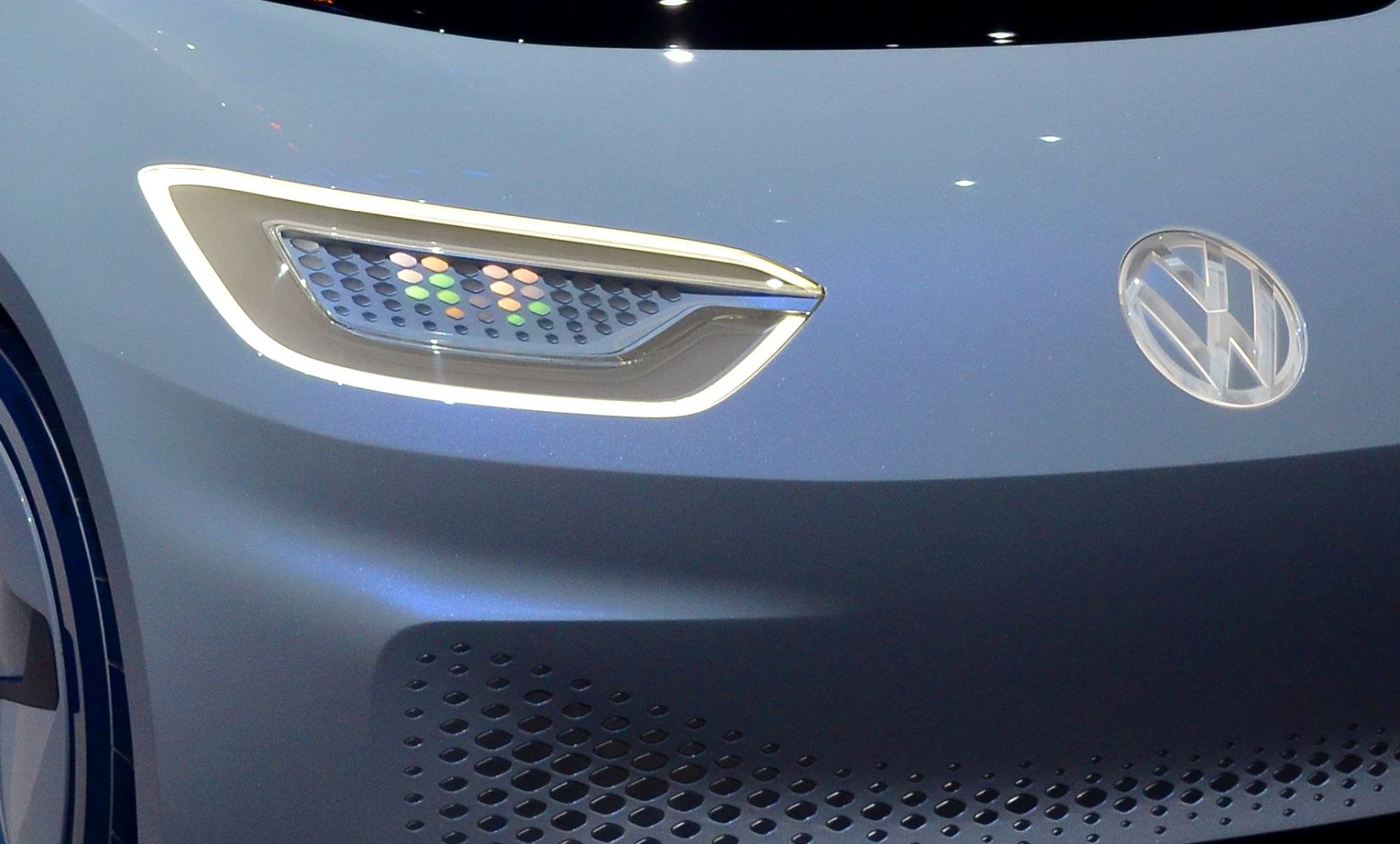 Futuristic front LED headlight and perforated grille