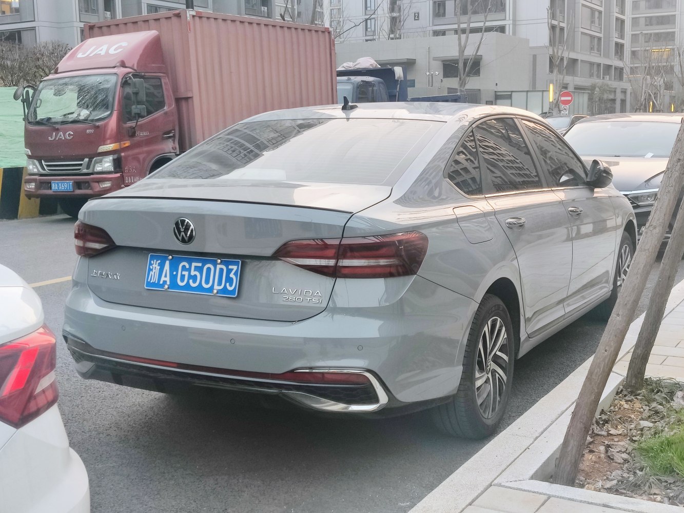 Rear view of modern sedan with LED taillights and 280 TSI badge