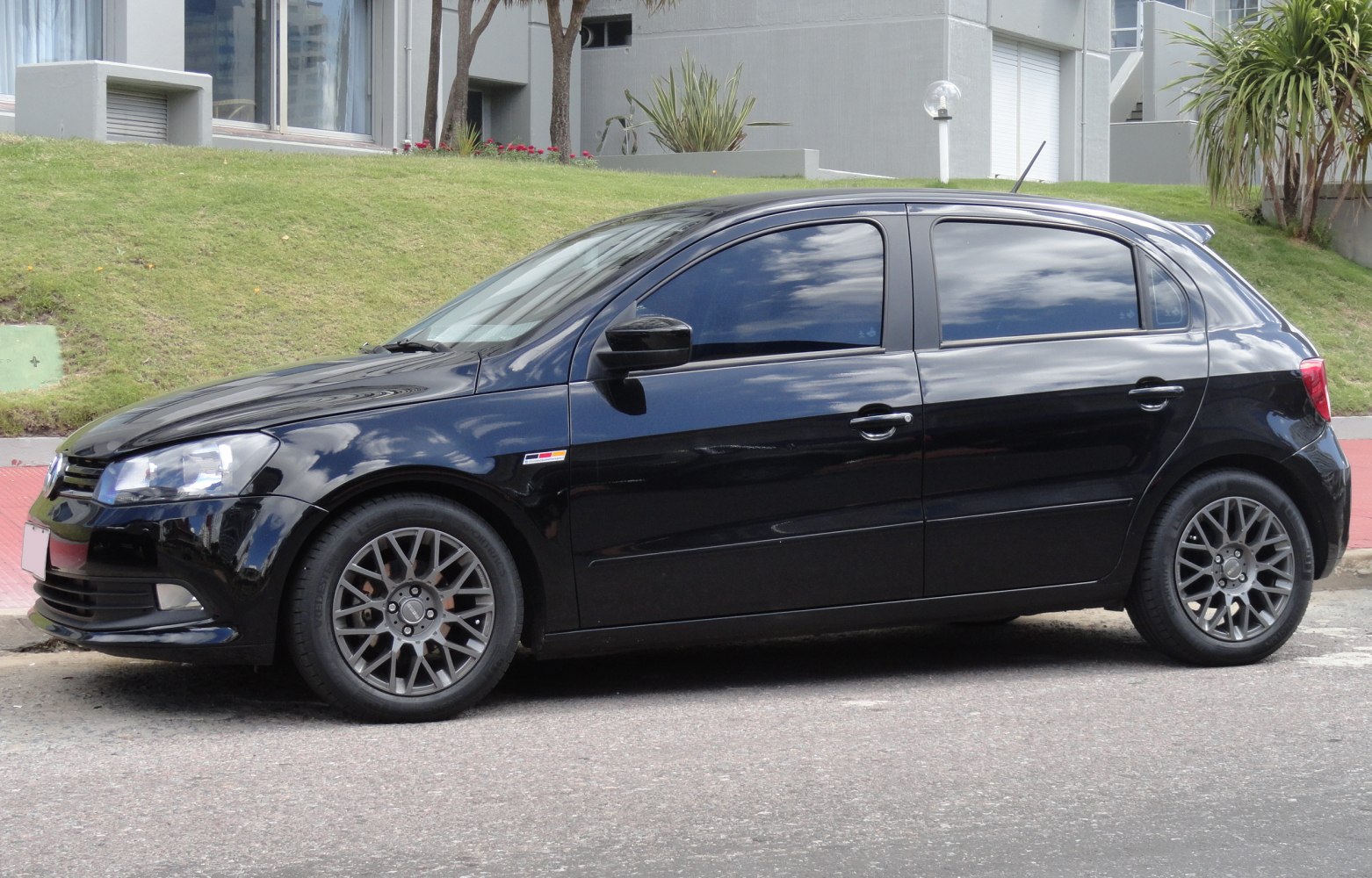 Black hatchback with alloy wheels and tinted windows
