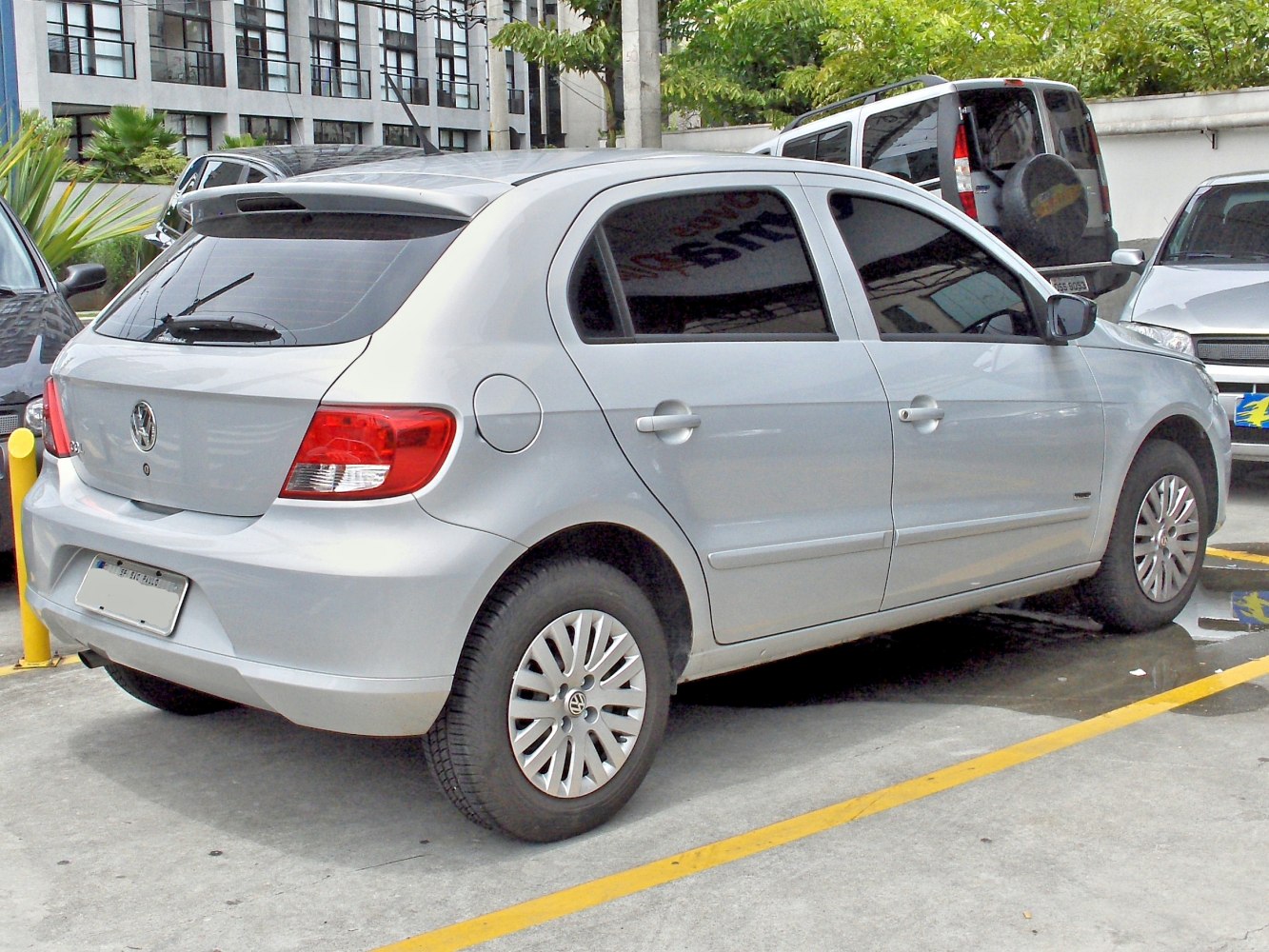 Silver hatchback showing rear and side profile