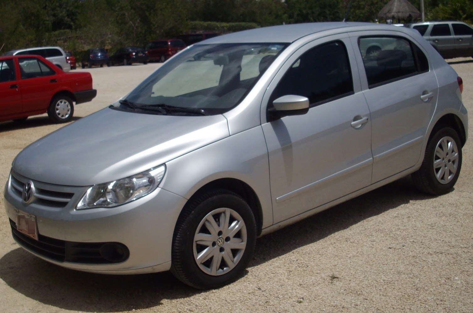 Silver hatchback with alloy wheels showing front side view