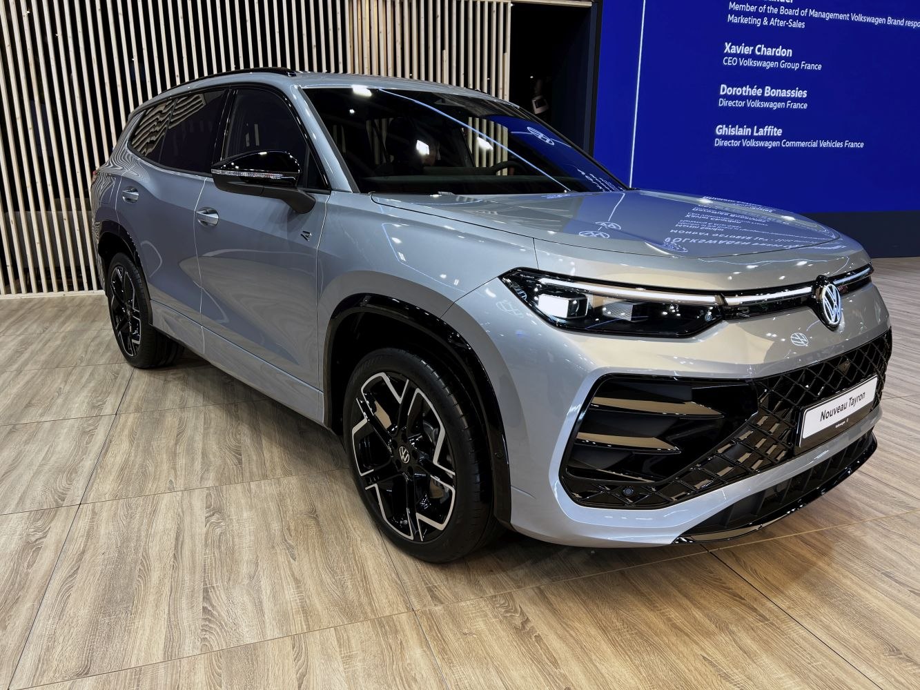 Front and side view of vehicle with LED headlights and aggressive grille