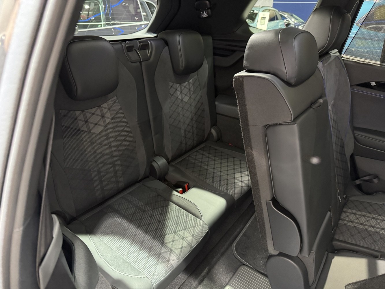 Third row seats with patterned upholstery in spacious interior