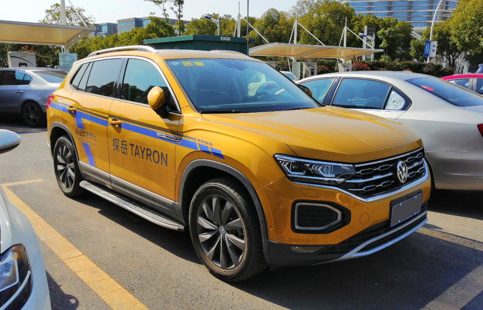 Yellow SUV with LED headlights, grille, side decals, and alloy wheels