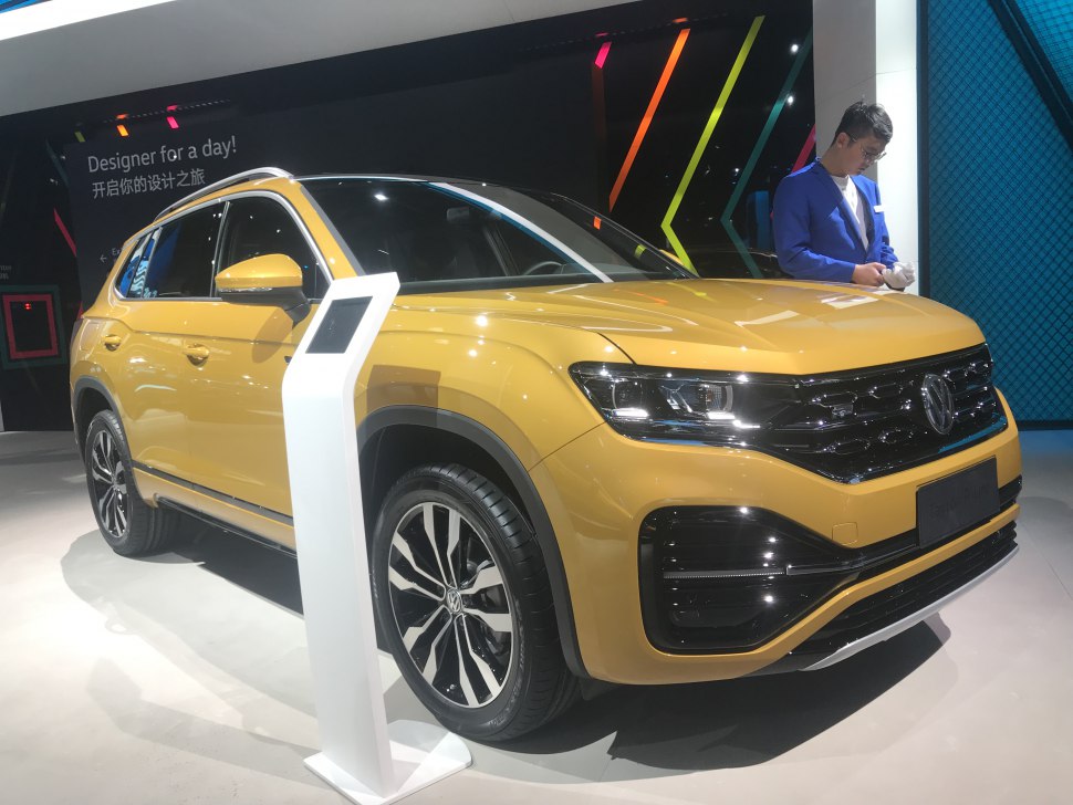 Front-side view of a yellow SUV with black grille and alloy wheels
