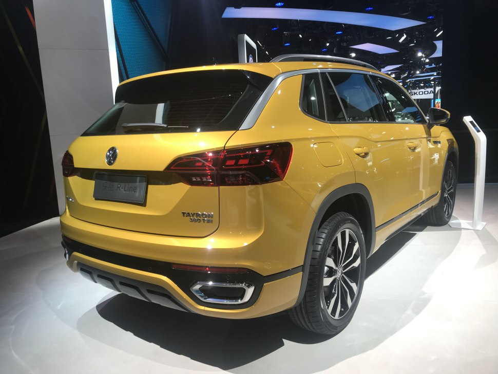 Yellow SUV rear view with LED taillights and alloy wheels