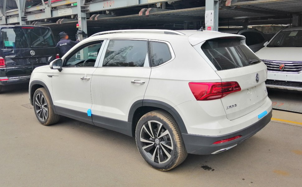 White SUV rear-side view with alloy wheels