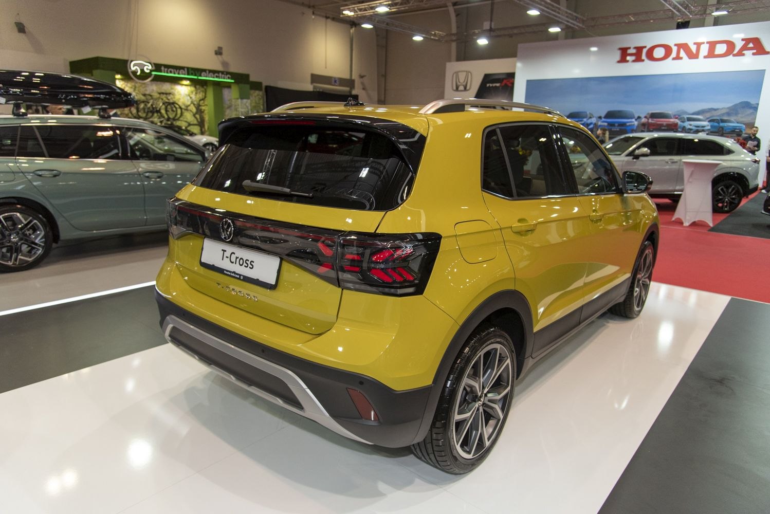 Rear view of yellow compact SUV with LED tail lights