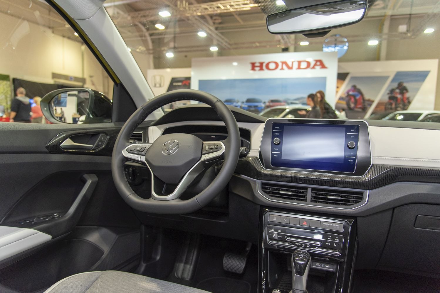 Modern car interior with digital dashboard and multifunction steering wheel
