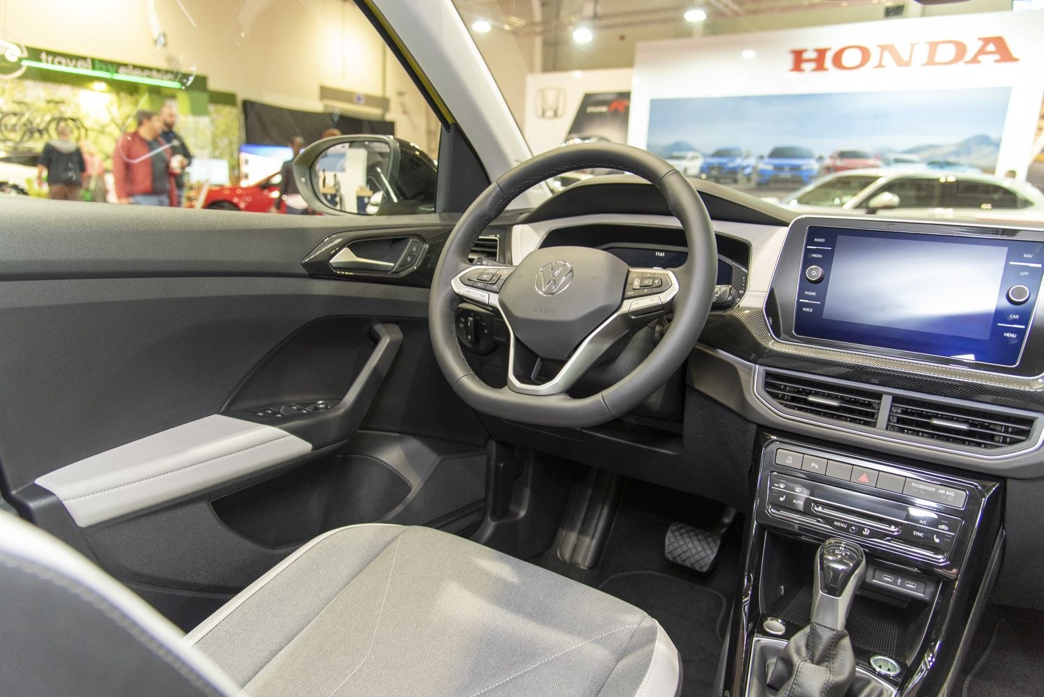 Steering wheel and touchscreen dashboard interior of a modern vehicle