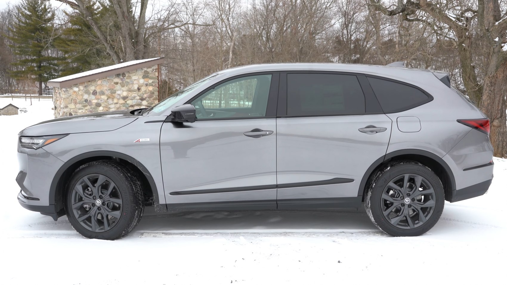 Side profile of SUV with black alloy wheels and sleek design