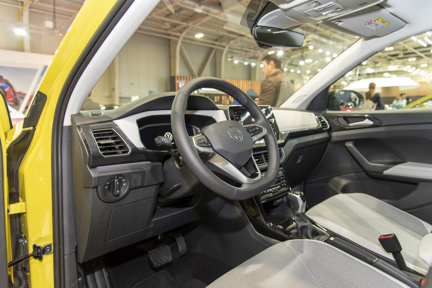 Modern steering wheel and digital dashboard with center console in vehicle interior