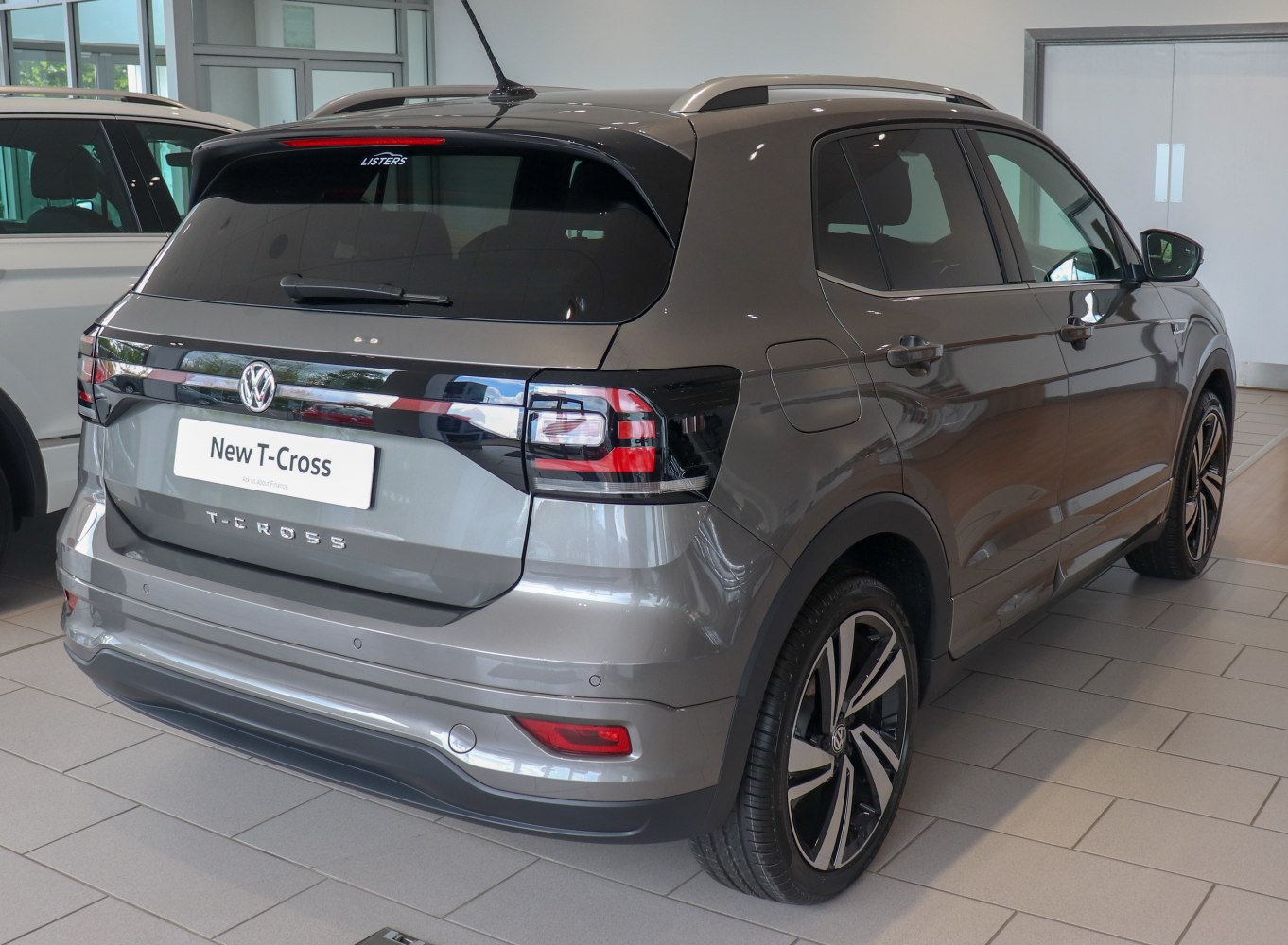 Rear view of an SUV with distinctive taillights and roof rails