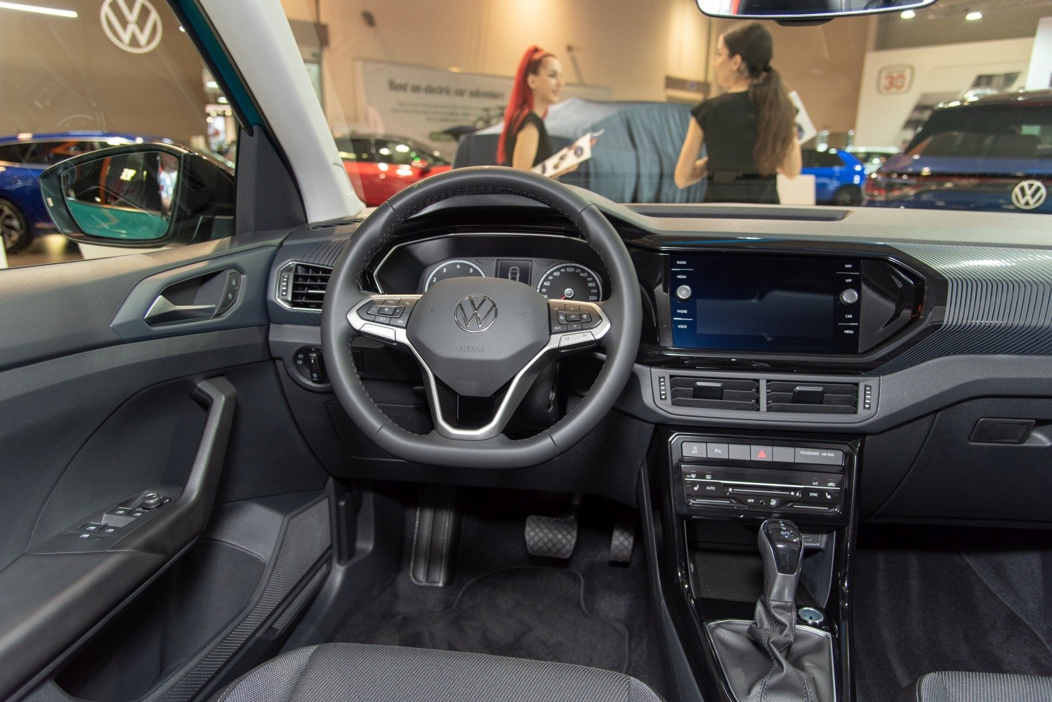 Interior view of steering wheel, dashboard, and center console
