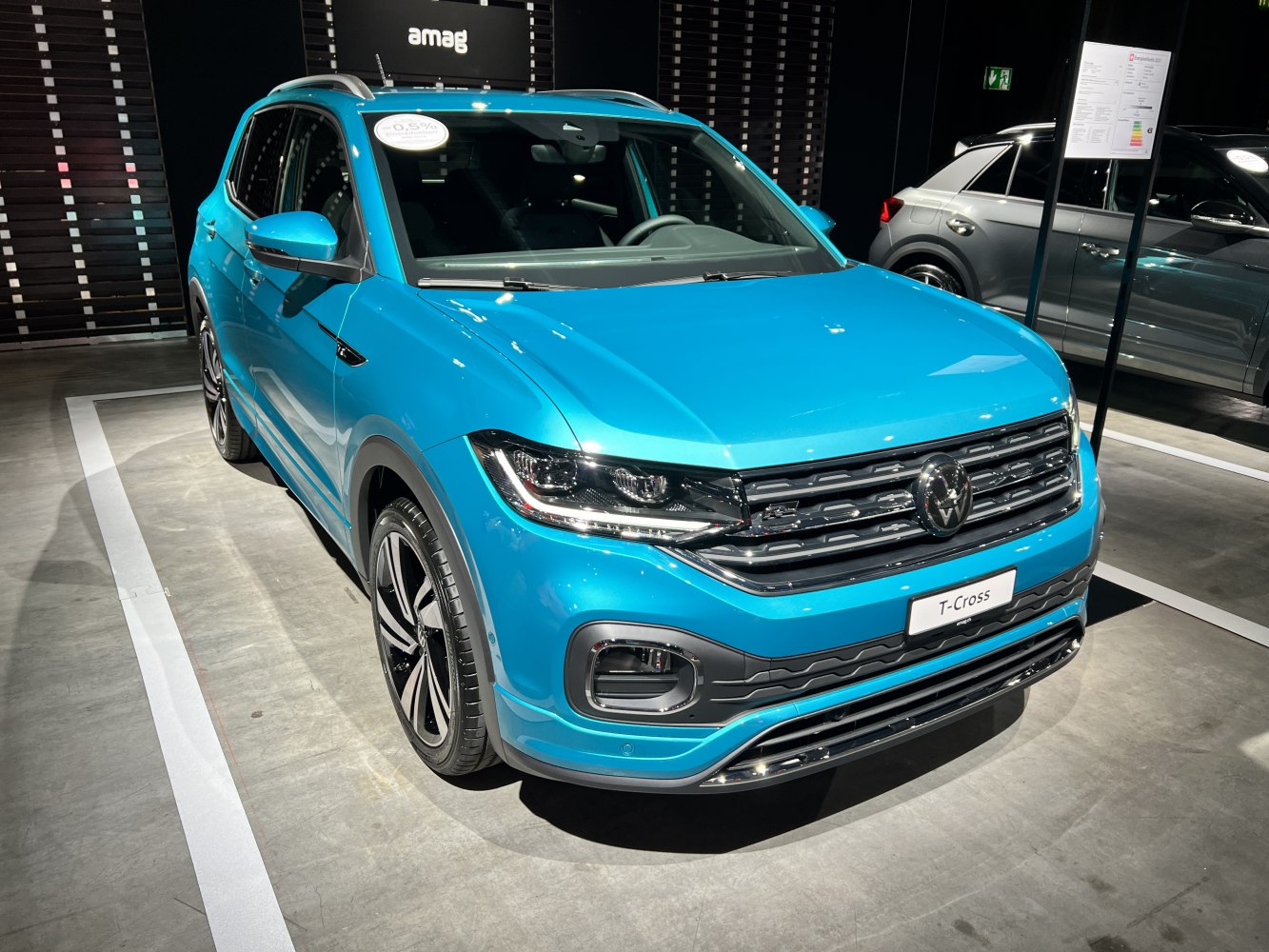 Front view of compact SUV with LED headlights and bold grille