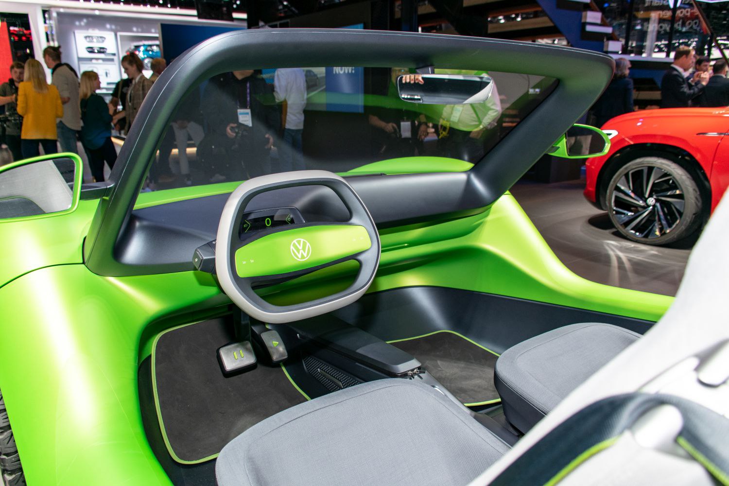 Futuristic electric cockpit with unique steering wheel and minimalist interior.
