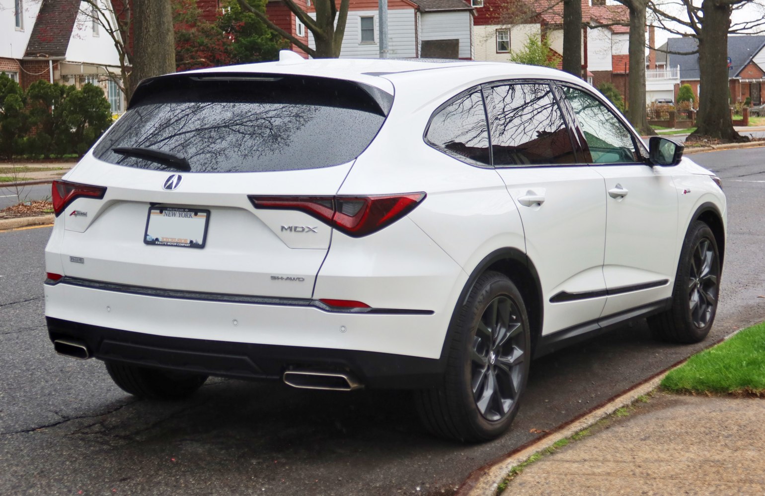 Rear view with distinctive tail lights and dual exhausts