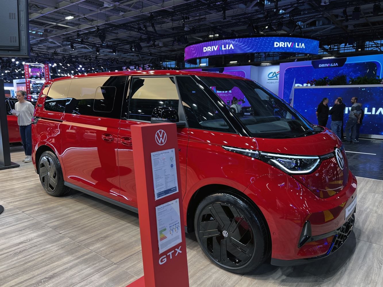 Red modern electric van with sleek headlights and aerodynamic design