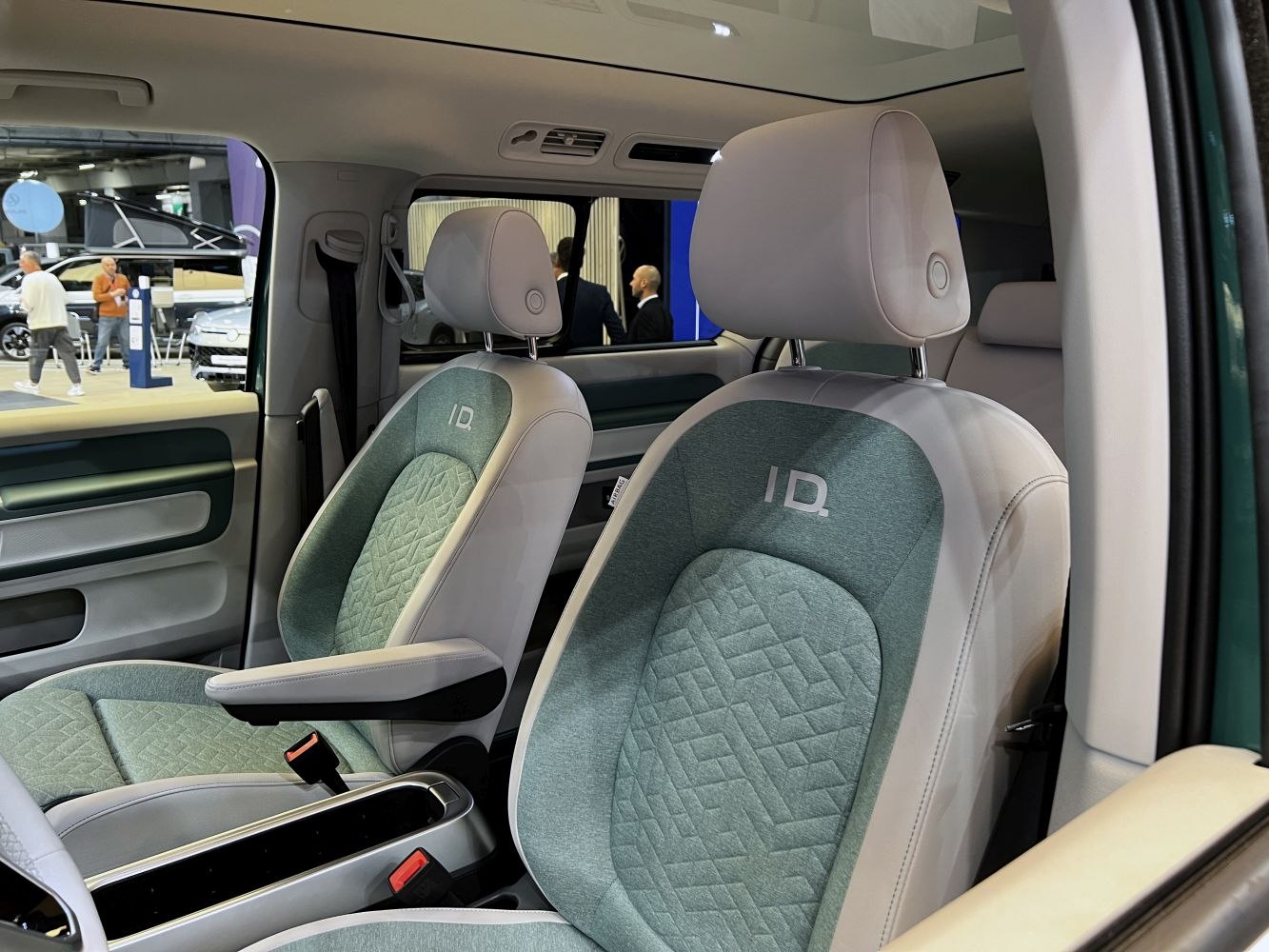 Front seats with green fabric and leather upholstery