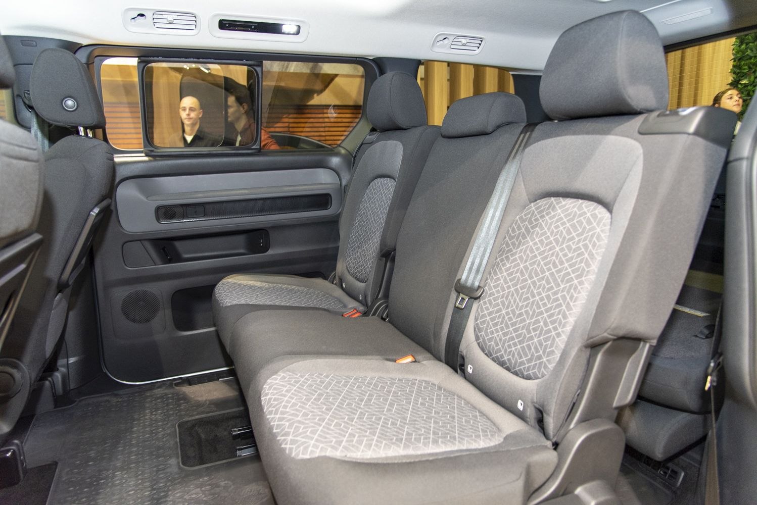 Spacious rear seating with patterned upholstery and large window