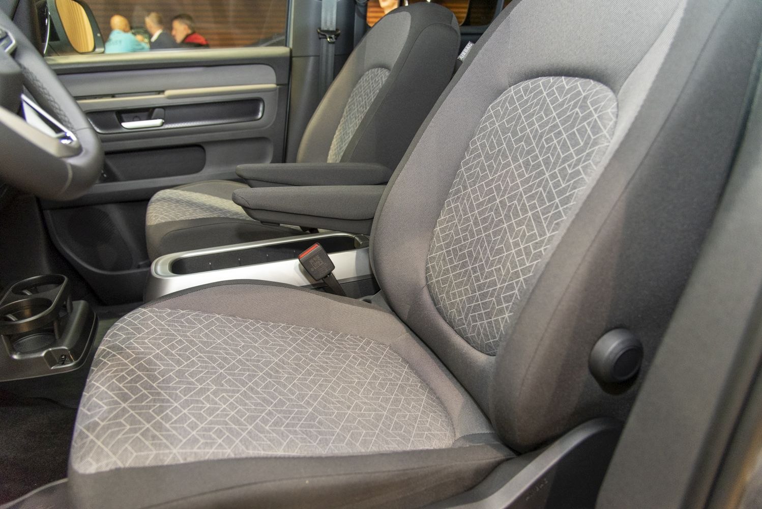 Front seats with patterned upholstery and armrests