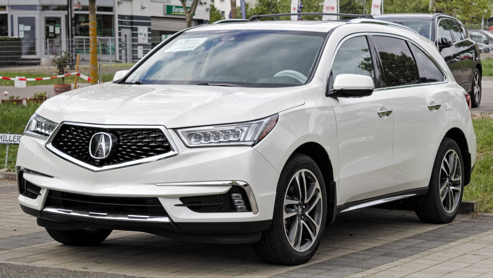 Front grille and LED headlights of a mid-size luxury SUV