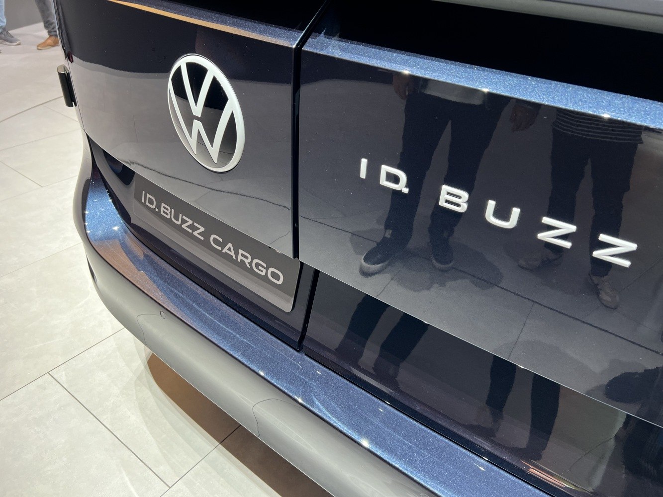 Close-up of rear badge and emblem on a dark rear panel