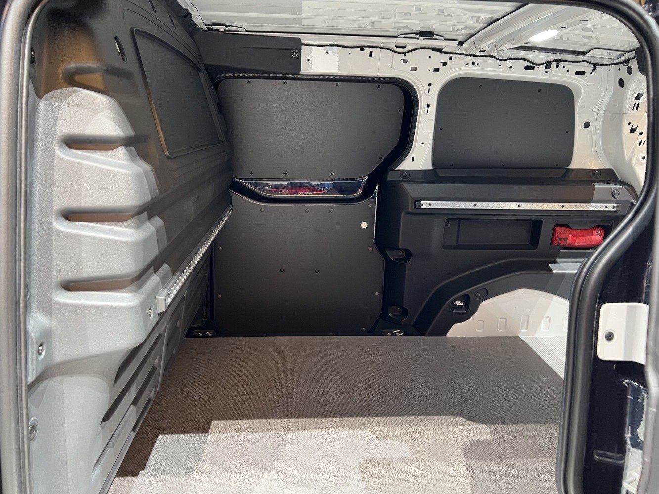Spacious and practical van cargo interior with protective paneling