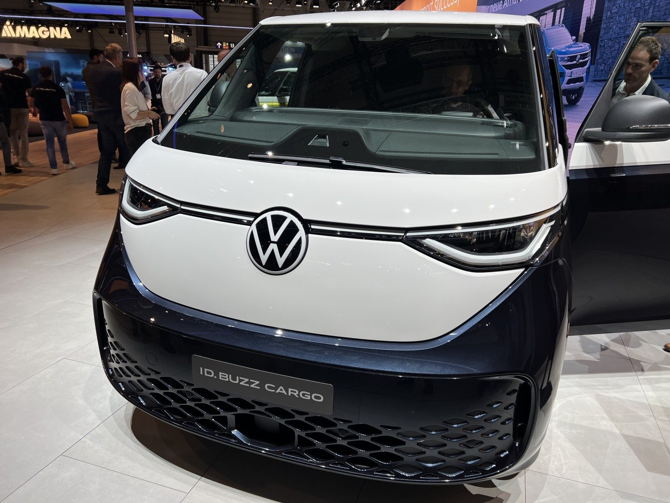 Front view with sleek headlights and unique grille pattern