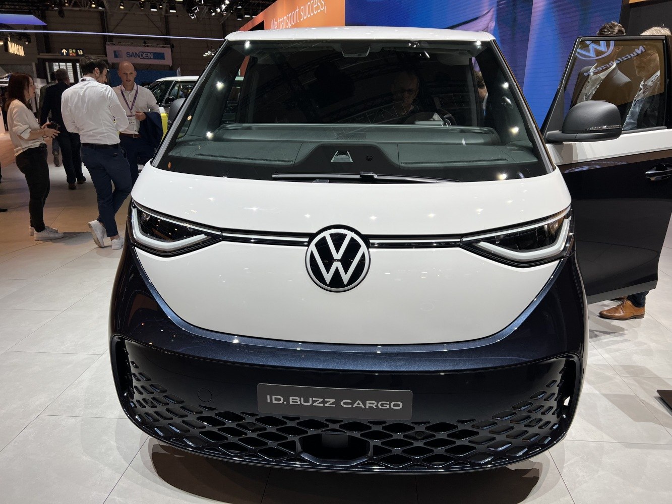 Front view with distinctive LED headlights and Volkswagen logo.
