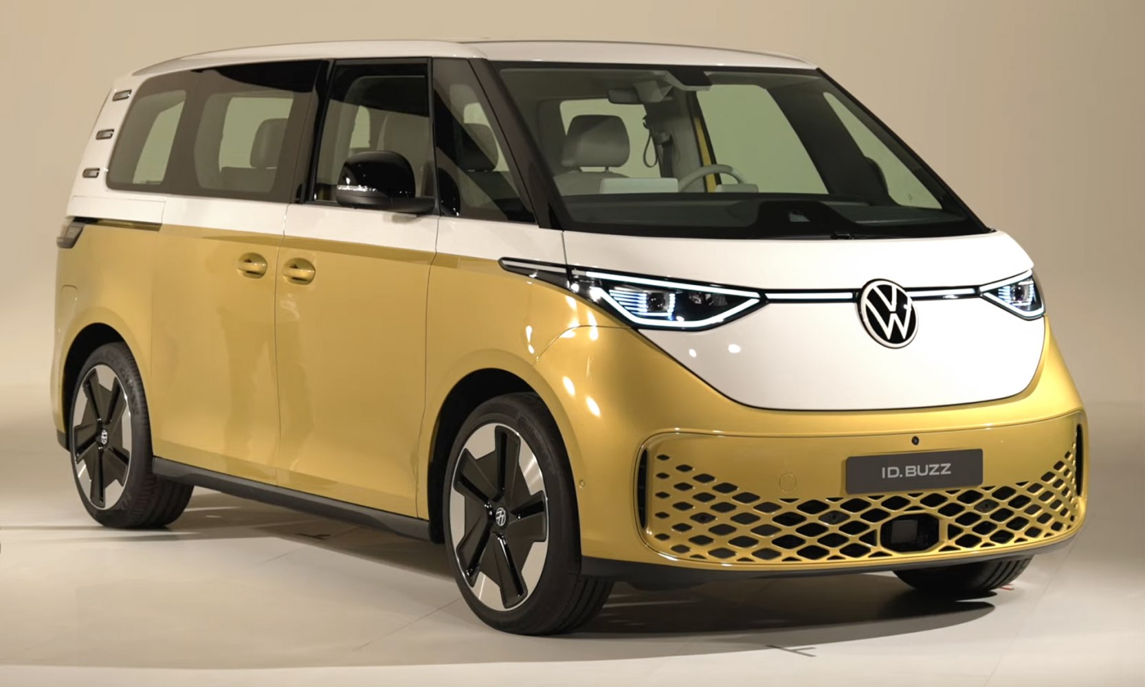 Electric van with LED headlights and two-tone yellow-white body design