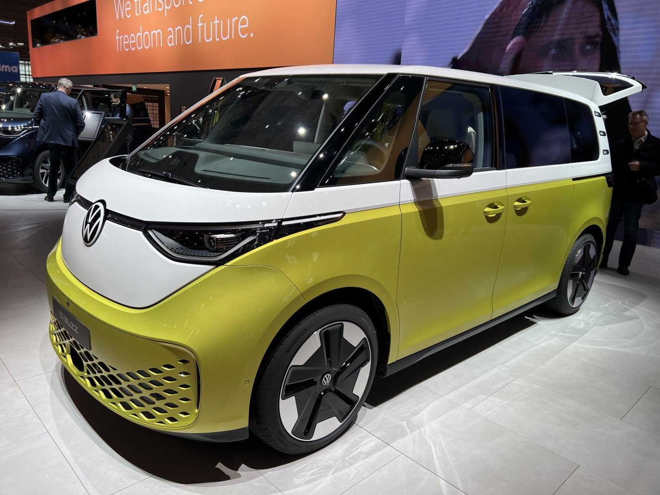 Futuristic front and side view of an electric van with two-tone paint and distinctive wheels
