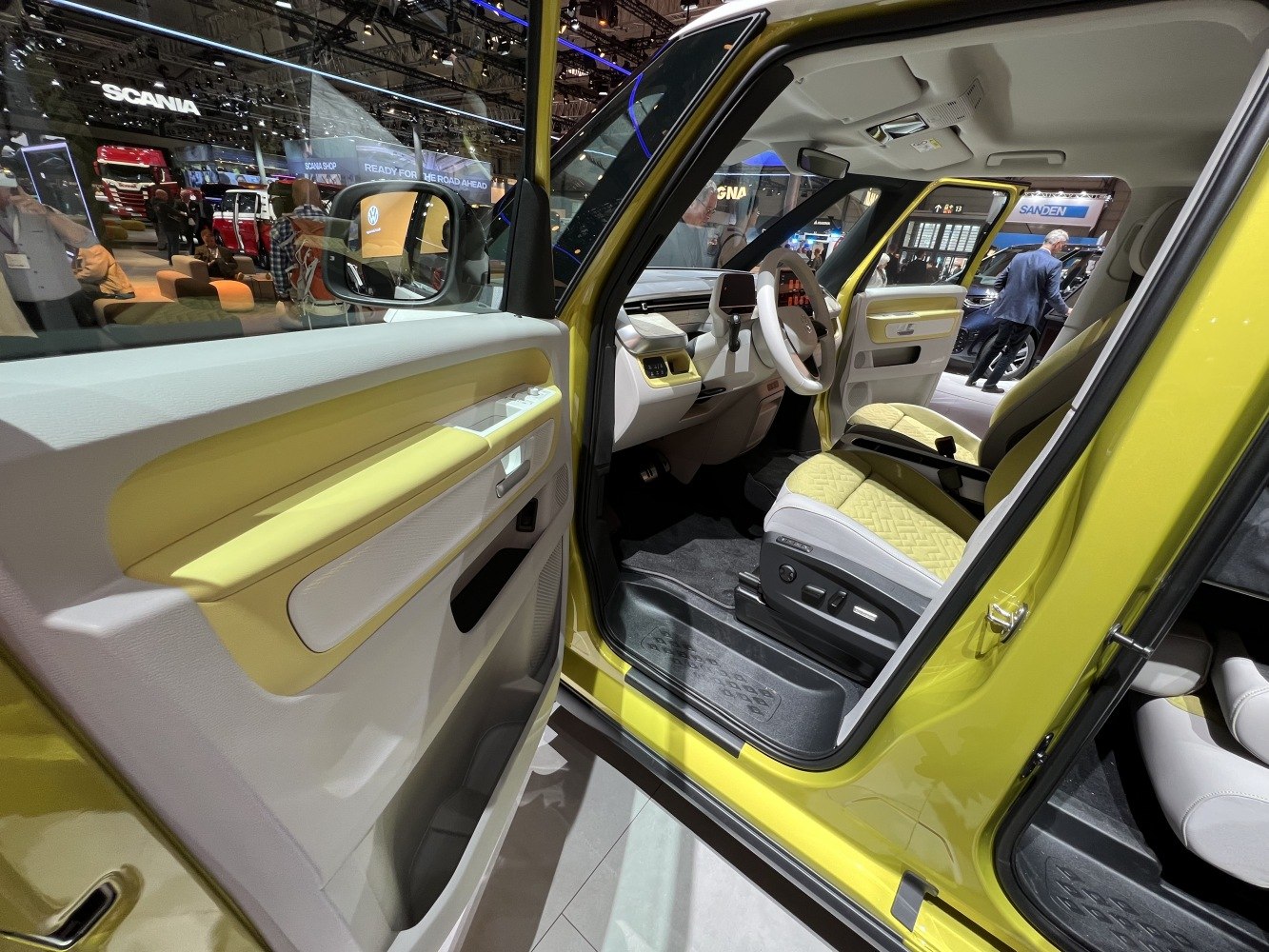 Modern electric vehicle interior with ergonomic seats and advanced dashboard.