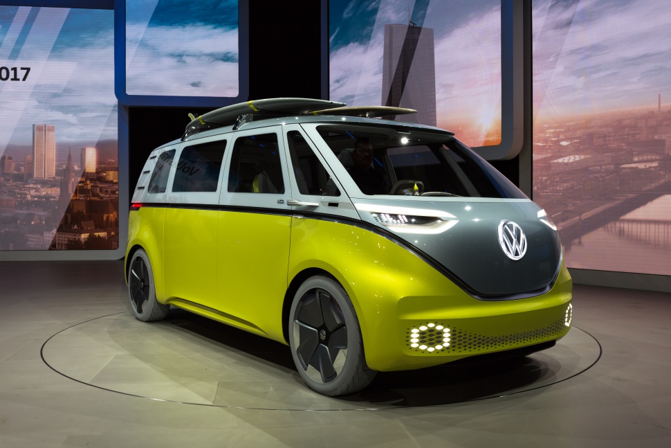 Futuristic electric minivan with retro-modern styling and advanced LED lighting.