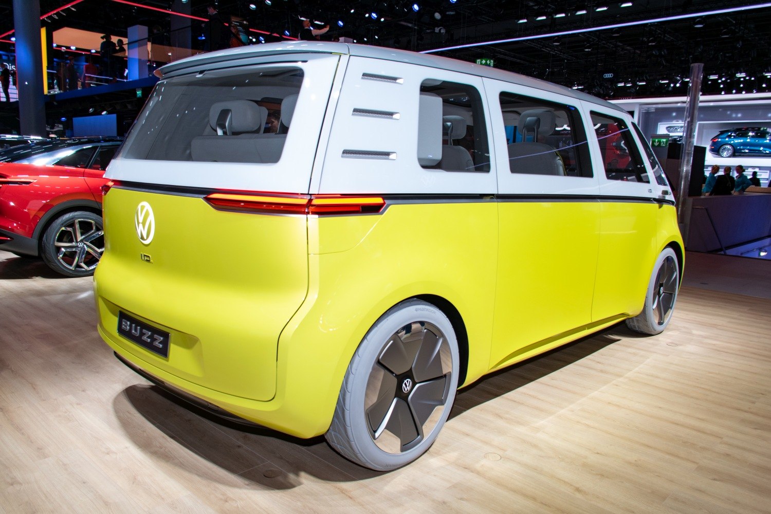 Rear perspective of a modern electric minivan with sleek lights and futuristic design