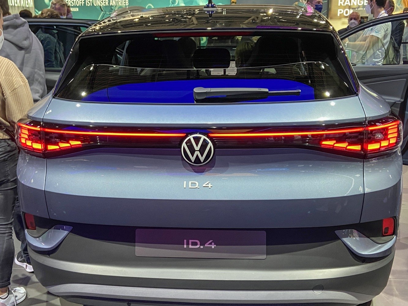 Rear view with connected LED tail lights and rear wiper on electric SUV