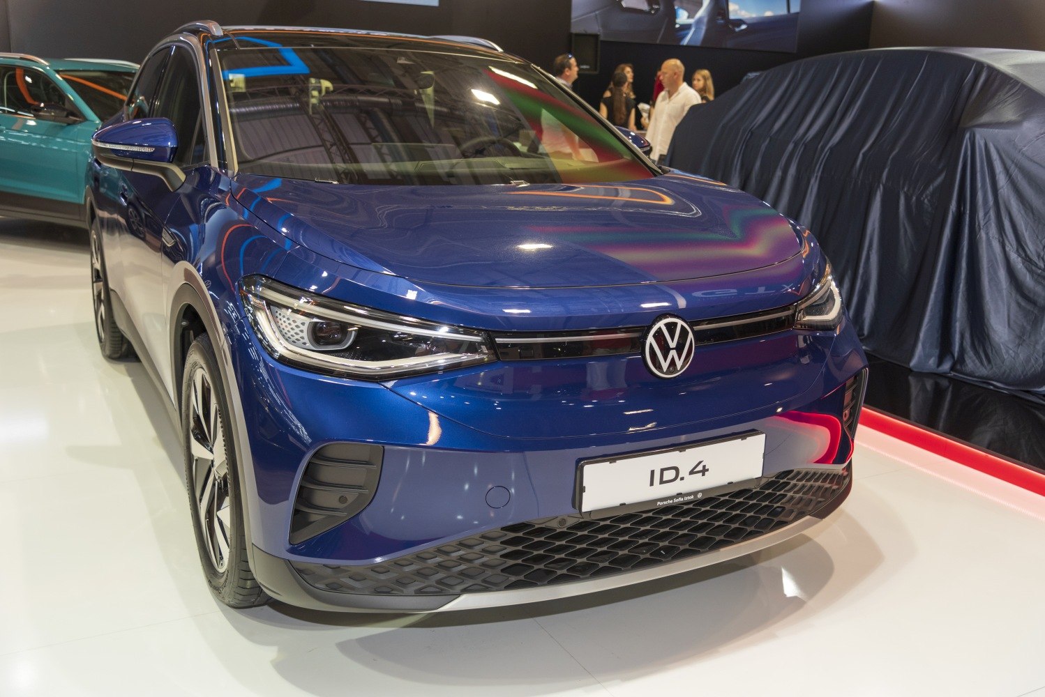 Front view of modern electric SUV with sleek headlights and aerodynamic design