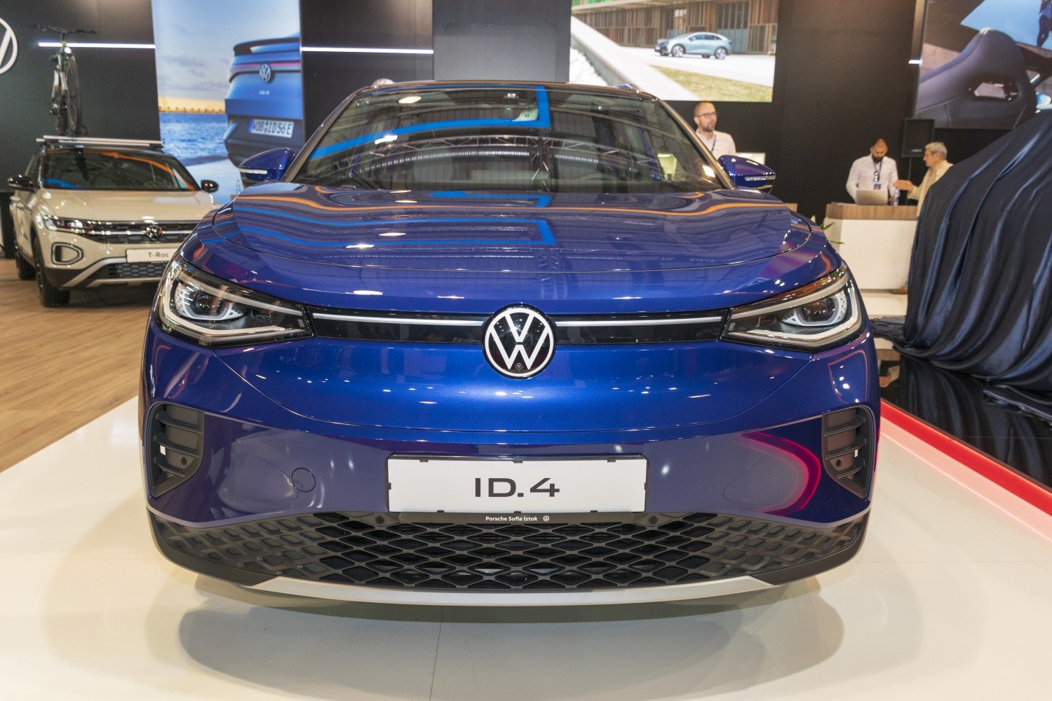 Front view with distinctive LED headlights and modern grille design.