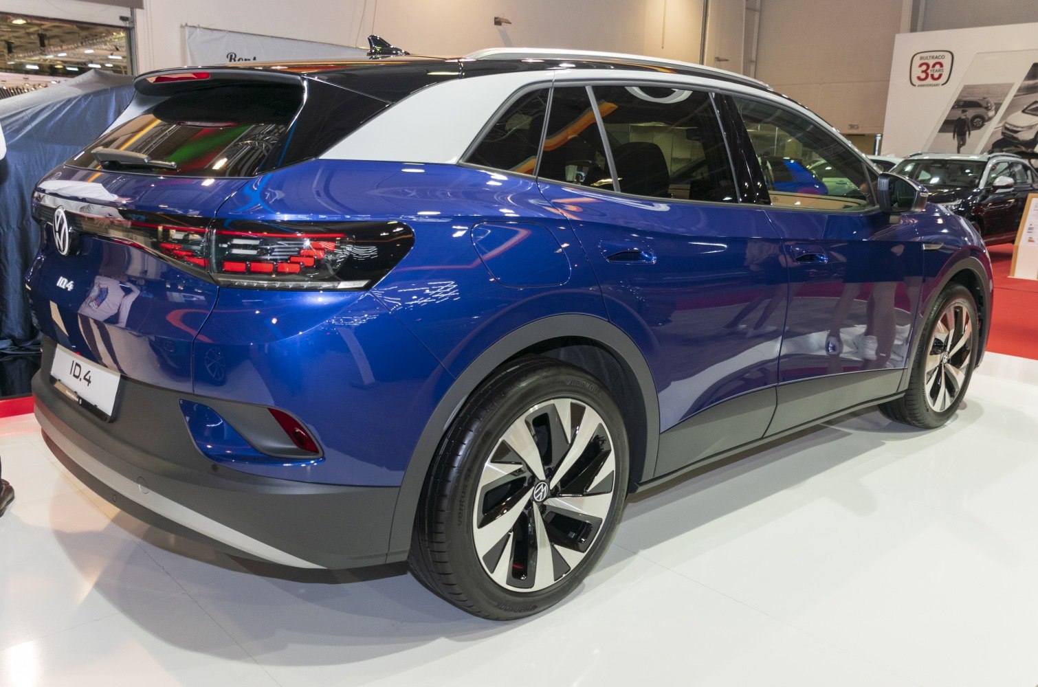 Rear and side profile of an electric SUV with distinctive LED tail lights and aerodynamic wheels