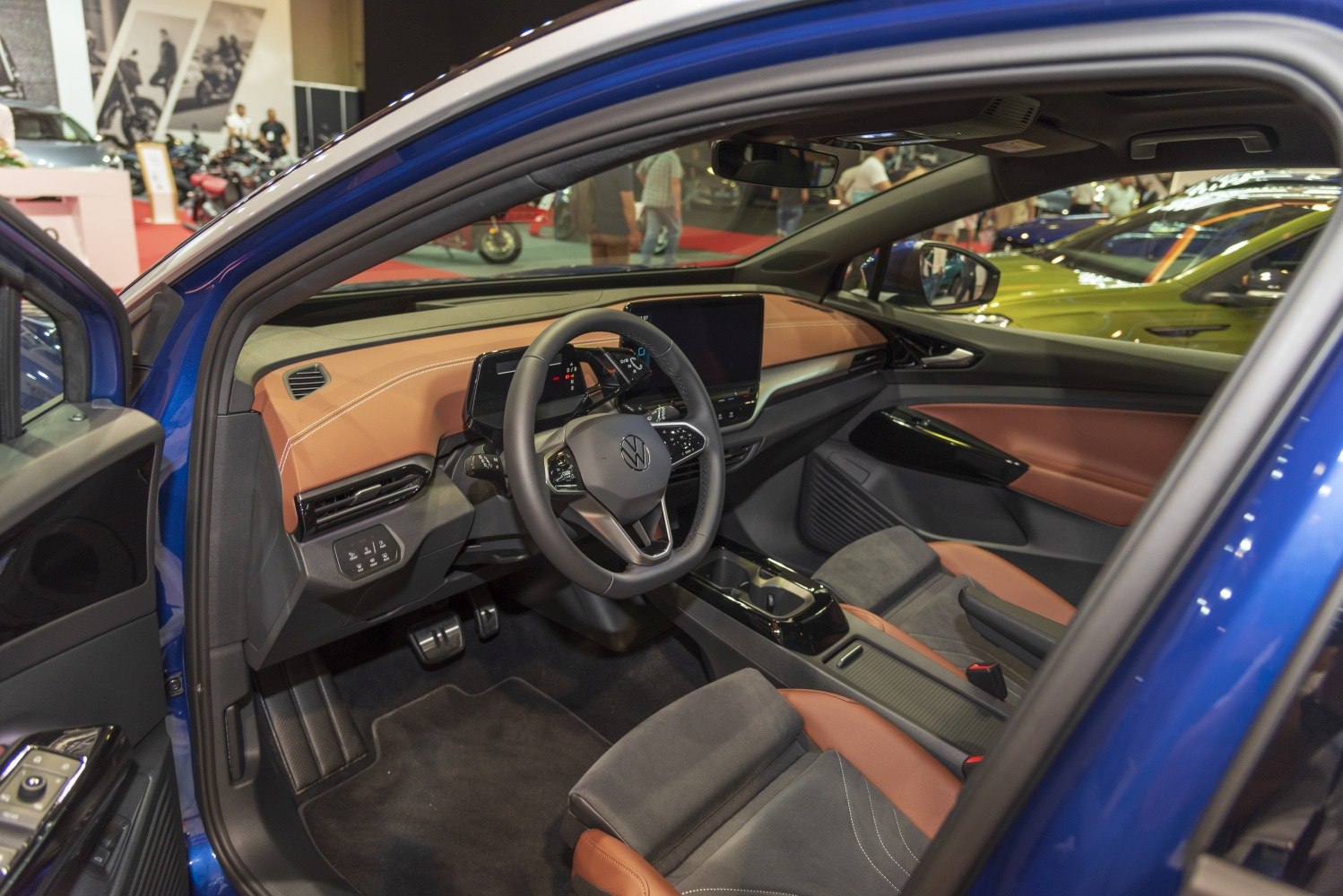 Steering wheel and digital dashboard display inside a modern car interior