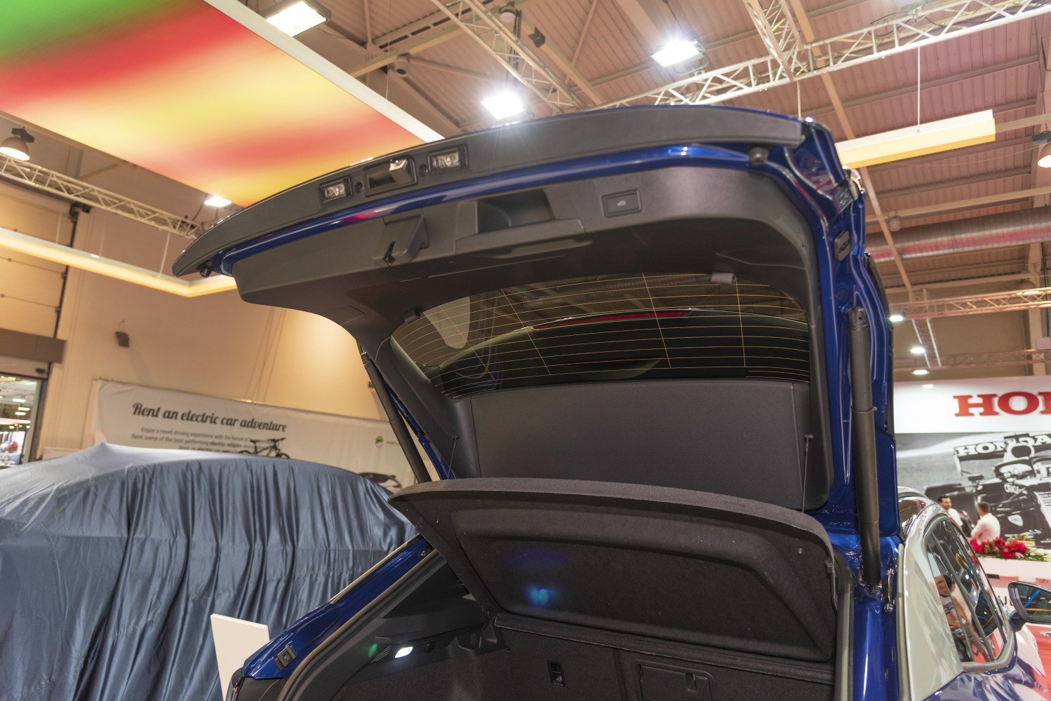 Open rear hatch and cargo cover showing trunk space