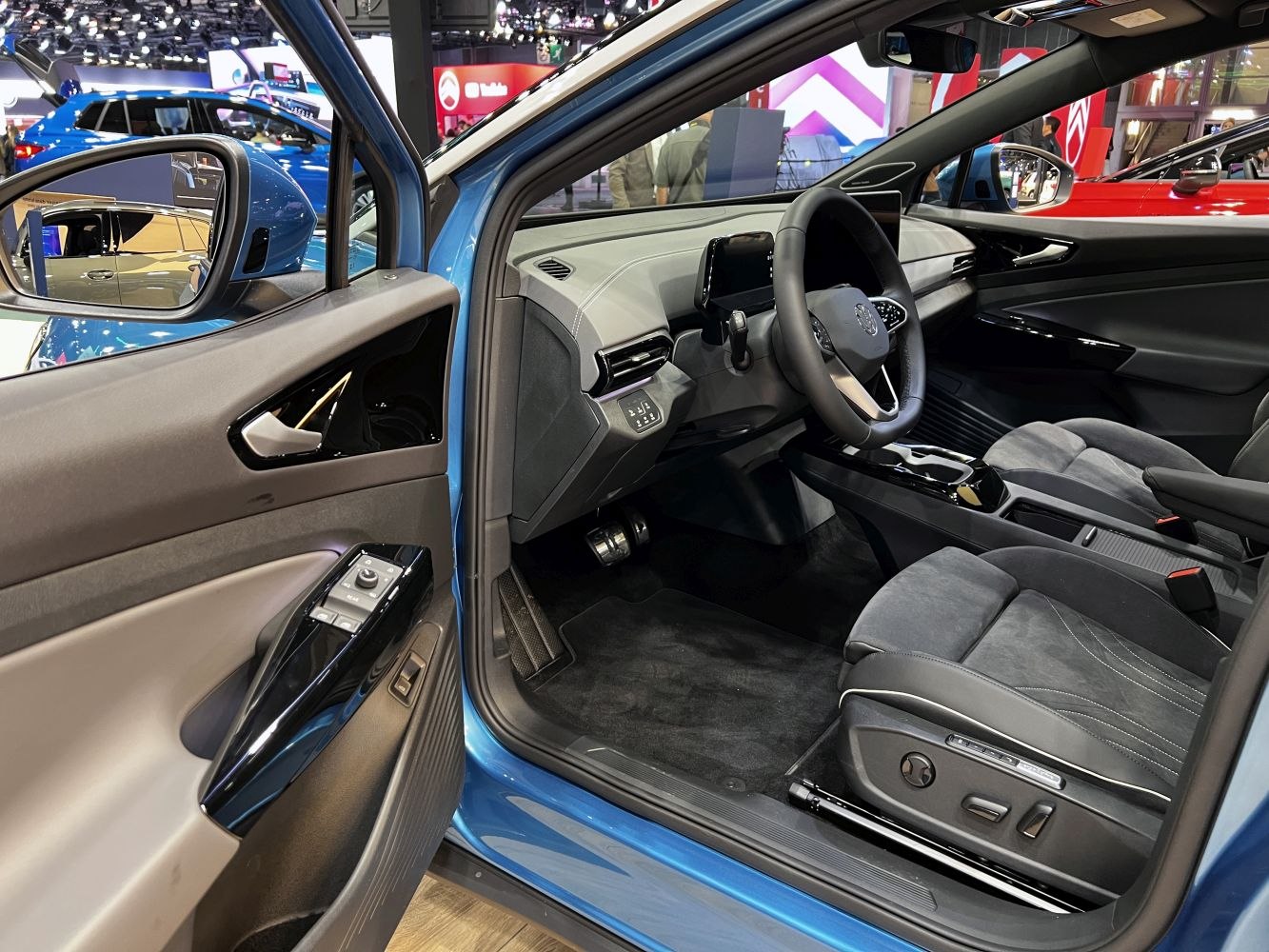 Modern electric SUV interior with digital dashboard and ergonomic front seats