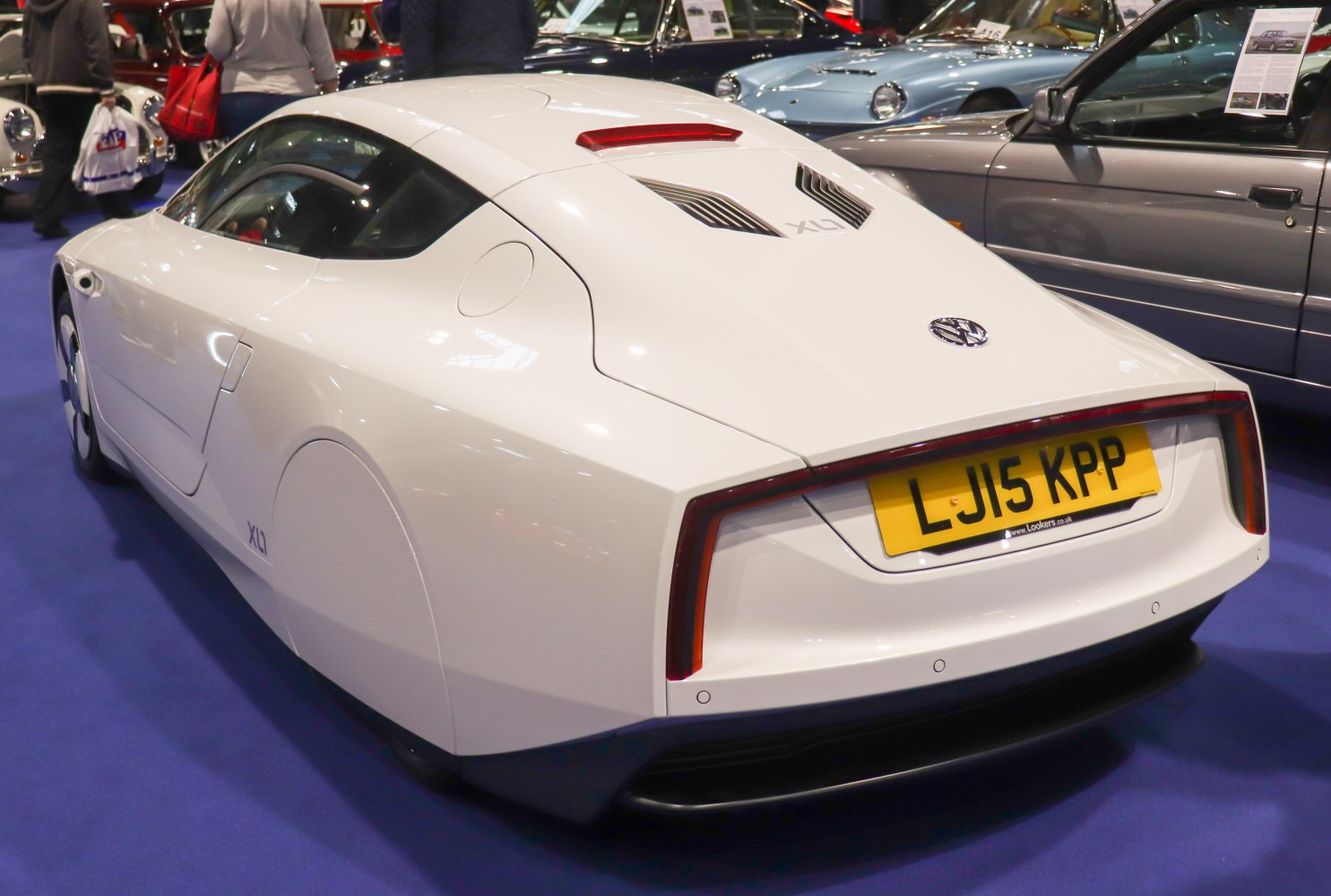 Rear aerodynamic design with continuous light bar and covered wheels.