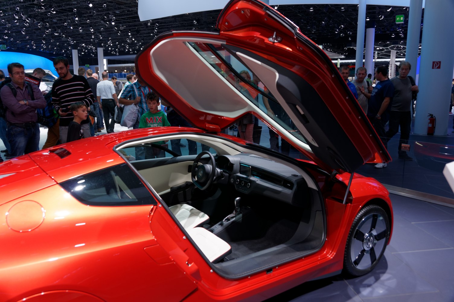 Futuristic gullwing door with minimalist car interior.
