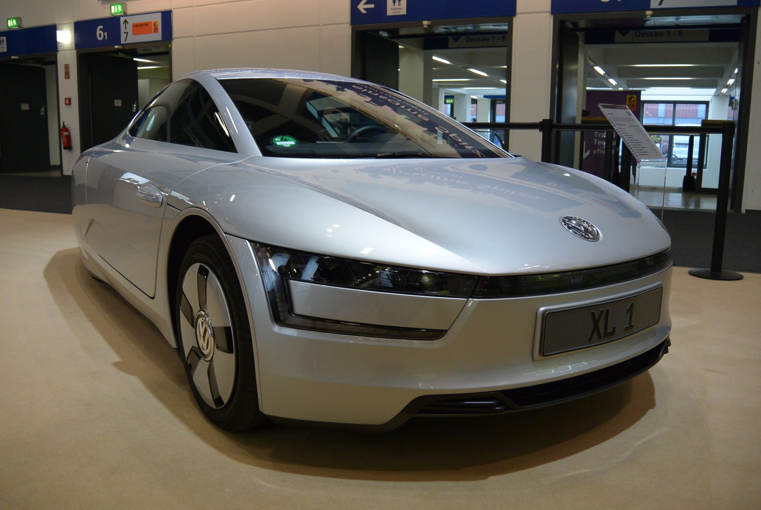 Aerodynamic front and side view with distinctive headlights and sleek design