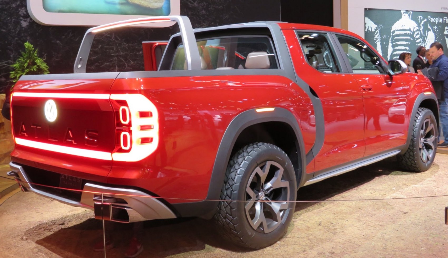 Modern pickup truck rear with unique taillight design and rugged tires