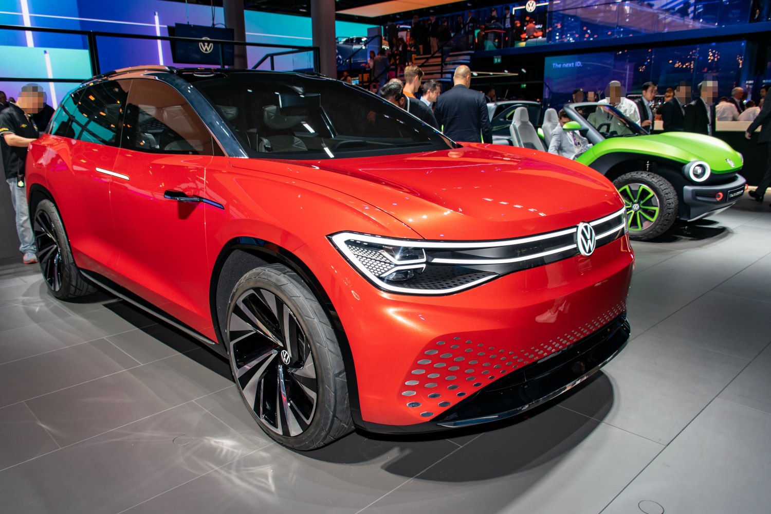 Front view of an electric SUV with futuristic LED headlights and sleek design
