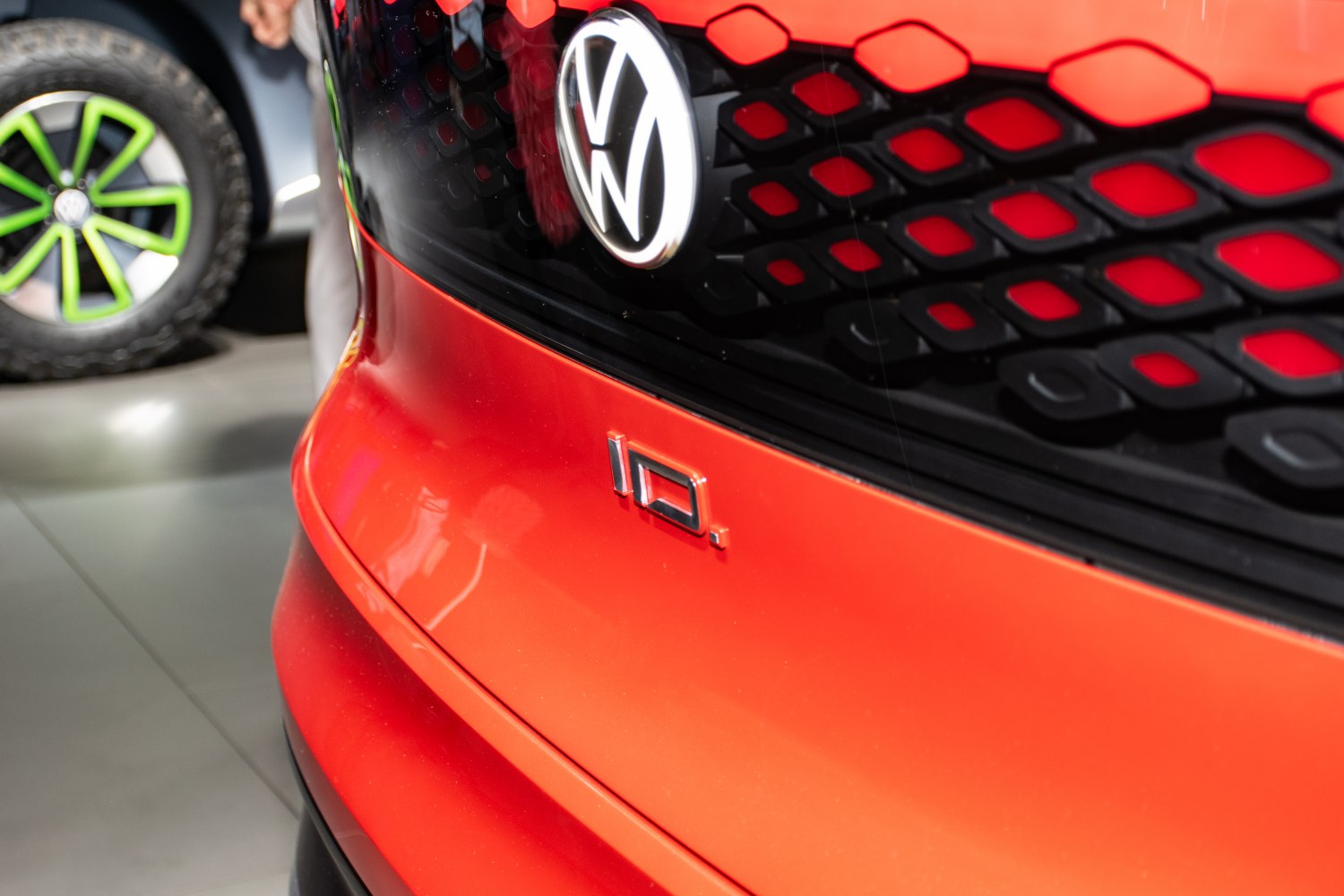 Close-up of front grille and ID badge on red car