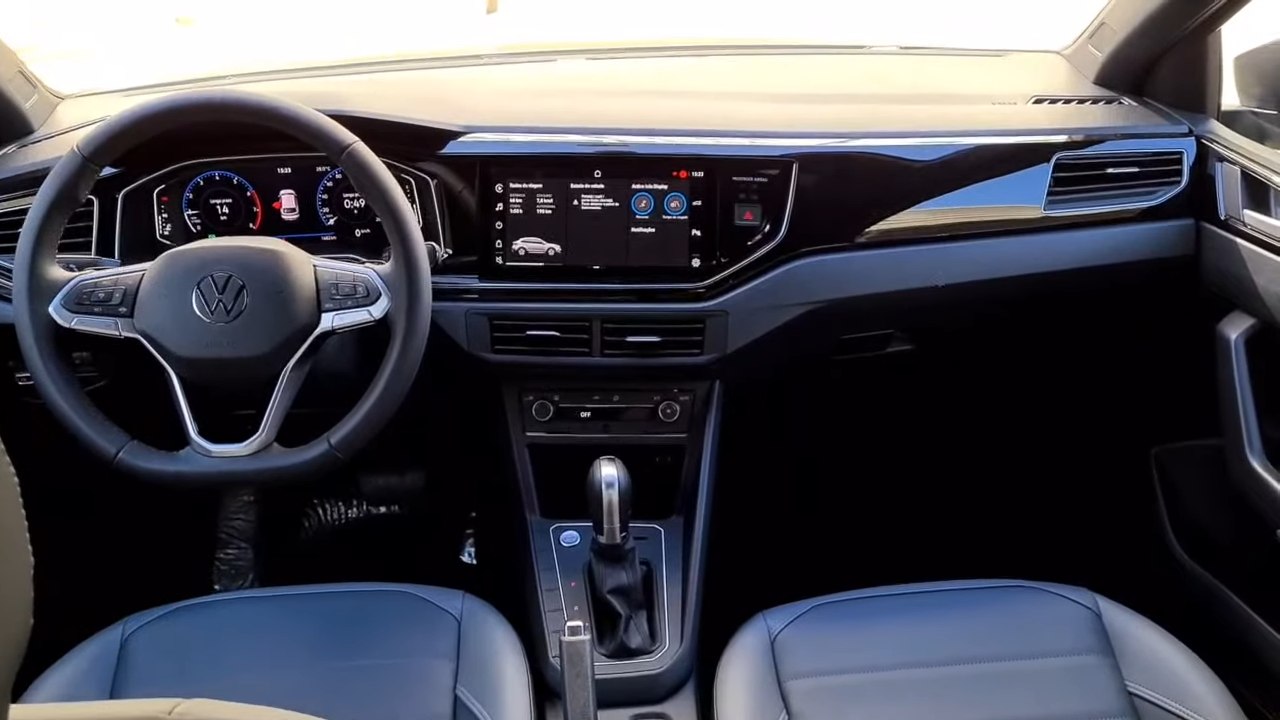 Digital instrument cluster and large central touchscreen with steering wheel controls