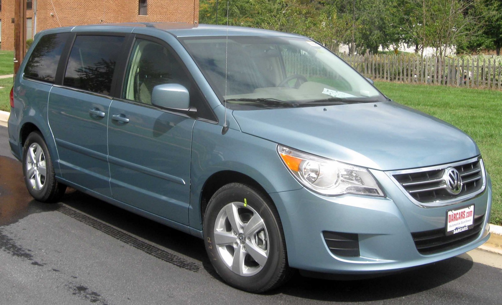 Blue minivan with chrome grille and alloy wheels